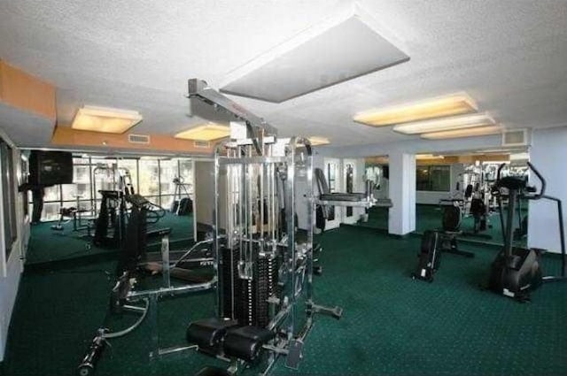 workout area featuring a textured ceiling