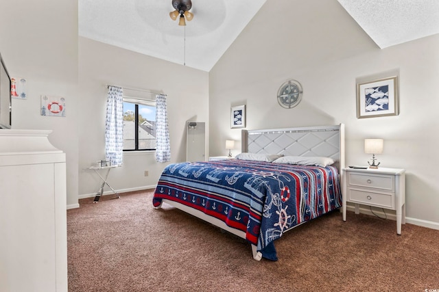 bedroom with carpet, a textured ceiling, vaulted ceiling, ceiling fan, and washer and dryer