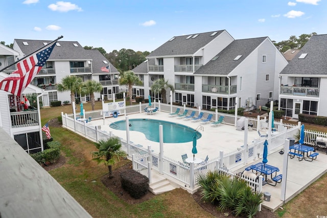 view of swimming pool with a patio