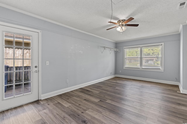 unfurnished room featuring hardwood / wood-style floors, ceiling fan, crown molding, and a textured ceiling