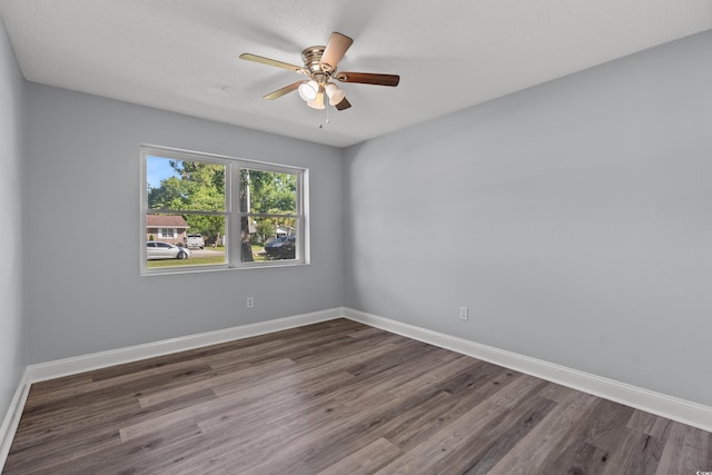 spare room featuring ceiling fan and hardwood / wood-style floors