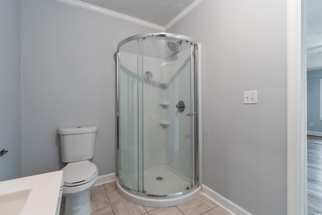 bathroom featuring tile patterned floors, a shower with shower door, a textured ceiling, and toilet