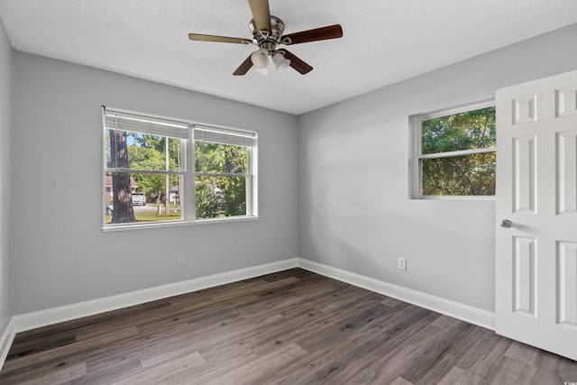 unfurnished room featuring hardwood / wood-style flooring, ceiling fan, and plenty of natural light