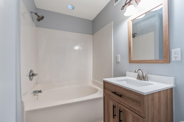 bathroom featuring shower / tub combination and vanity