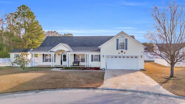 view of front facade with a garage, covered porch, and a front lawn