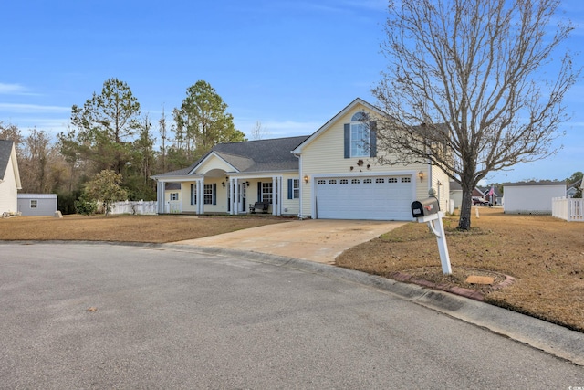 front facade with a porch, a garage, and a front lawn