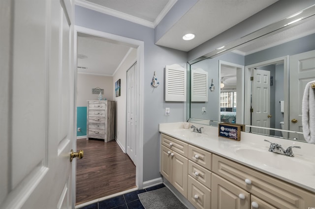 bathroom with vanity, tile patterned floors, and ornamental molding