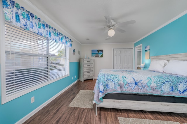 bedroom with ceiling fan, dark hardwood / wood-style flooring, ornamental molding, and a closet