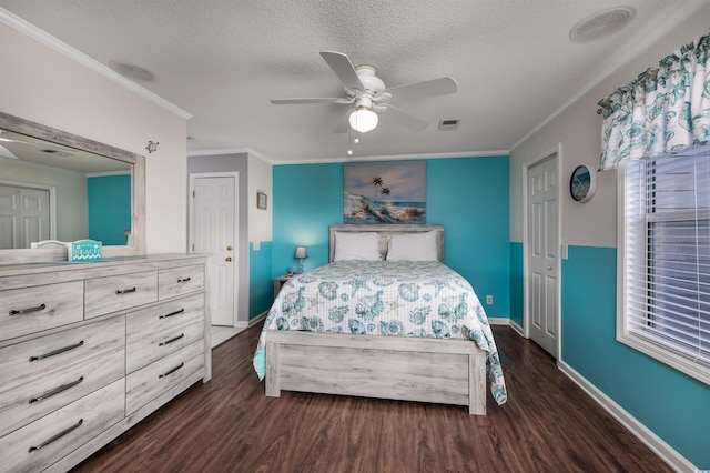 bedroom featuring a textured ceiling, ceiling fan, dark hardwood / wood-style floors, and ornamental molding