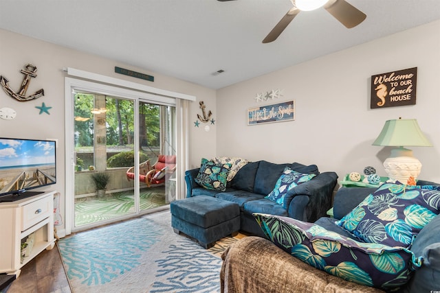 living room with hardwood / wood-style floors and ceiling fan