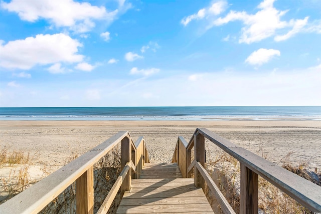 view of community with a view of the beach and a water view