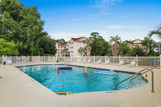 view of swimming pool featuring a patio