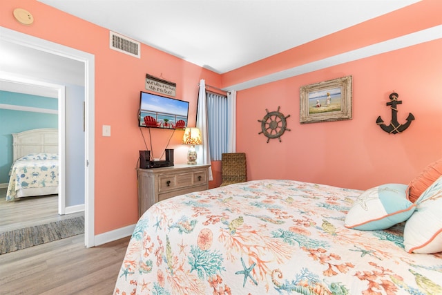 bedroom with light wood-type flooring