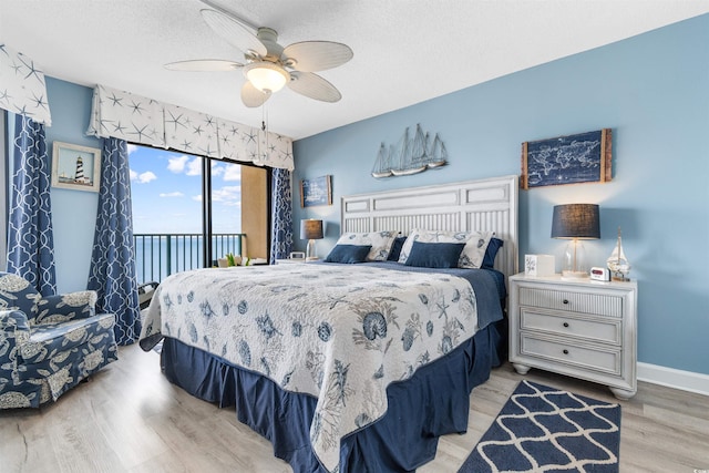 bedroom featuring access to exterior, ceiling fan, a textured ceiling, and light wood-type flooring