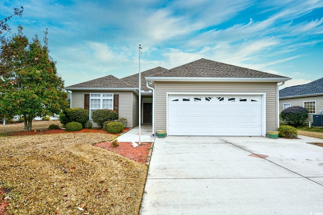 ranch-style house featuring a garage