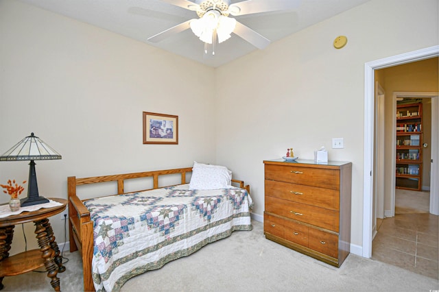 bedroom featuring ceiling fan and light colored carpet