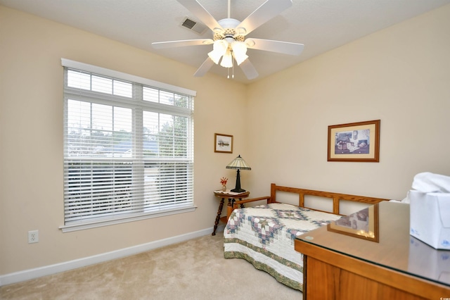 carpeted bedroom with ceiling fan