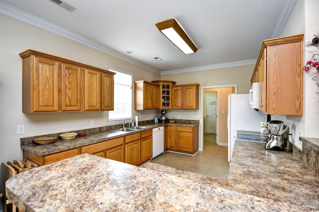 kitchen featuring light tile patterned flooring, white appliances, crown molding, and sink