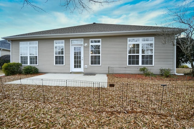 back of property with a patio area