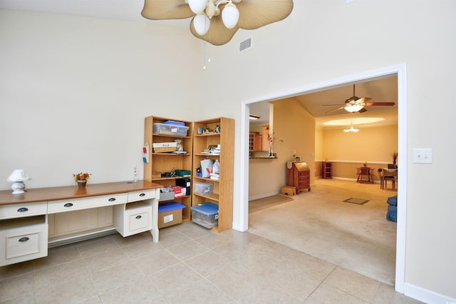 office area with ceiling fan, light tile patterned floors, built in desk, and lofted ceiling