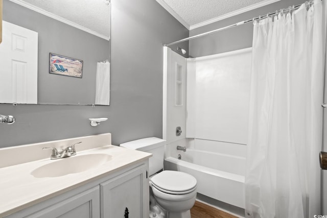 full bathroom featuring vanity, shower / bath combo, toilet, ornamental molding, and a textured ceiling