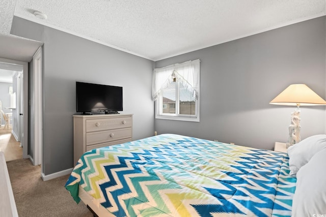 carpeted bedroom with a textured ceiling