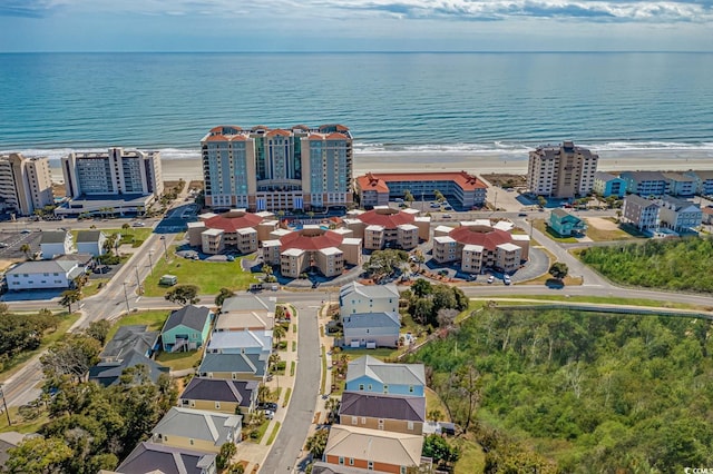 aerial view featuring a water view and a beach view