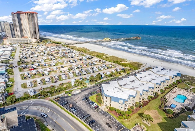 bird's eye view with a water view and a view of the beach