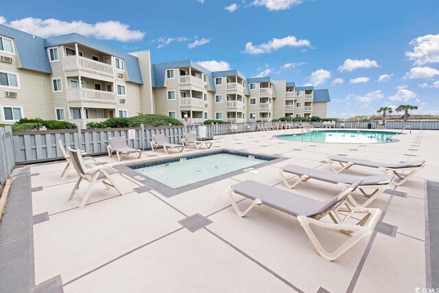 view of swimming pool with a patio area