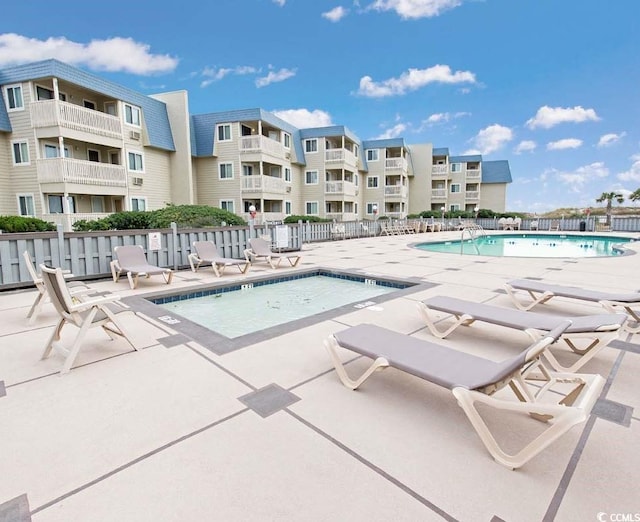 view of swimming pool featuring a patio area