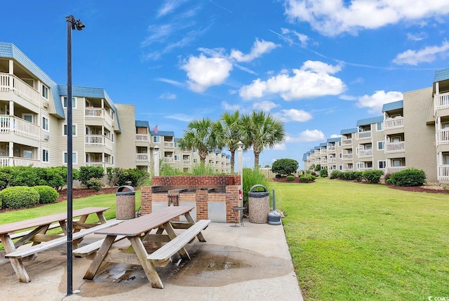 view of community with a patio area and a yard