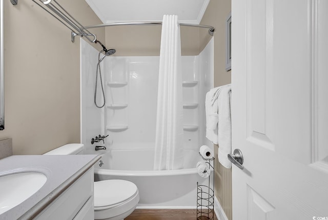 full bathroom featuring vanity, crown molding, toilet, wood-type flooring, and shower / tub combo