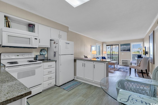 kitchen featuring kitchen peninsula, ornamental molding, white appliances, white cabinets, and light hardwood / wood-style floors