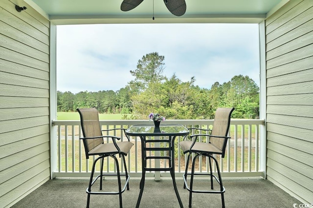 balcony featuring ceiling fan