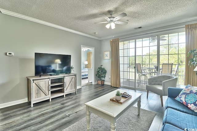 living room with a textured ceiling, ceiling fan, and ornamental molding