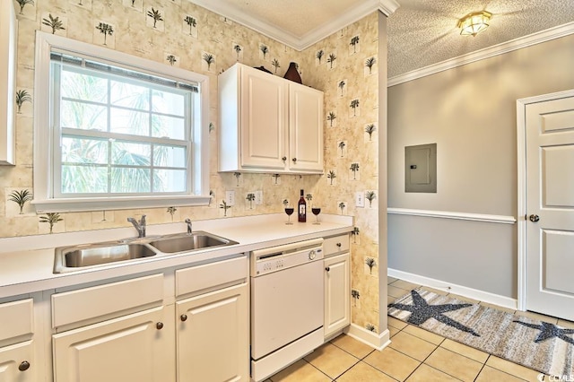 kitchen with dishwasher, crown molding, sink, light tile patterned flooring, and white cabinetry