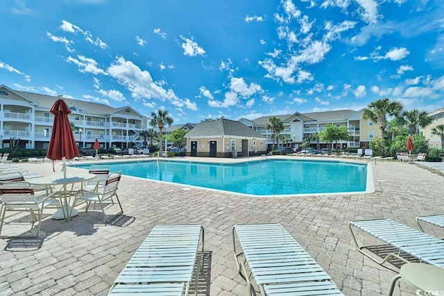 view of swimming pool with a patio