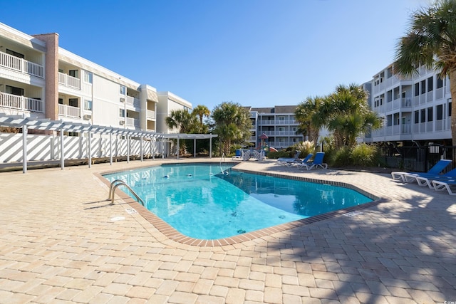 view of pool featuring a pergola and a patio