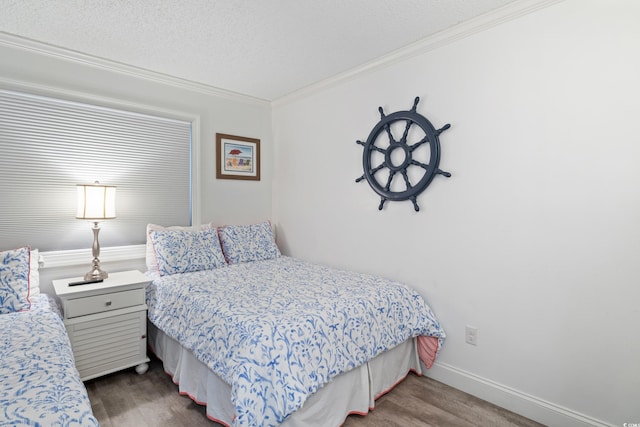 bedroom featuring a textured ceiling and crown molding