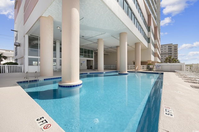 view of swimming pool with a patio area