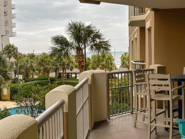 balcony featuring a water view