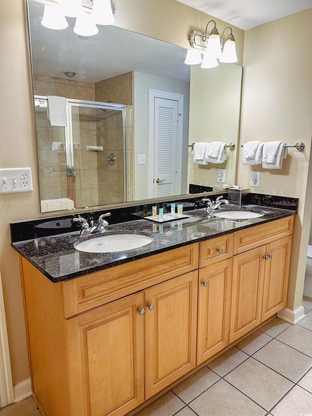 bathroom featuring an inviting chandelier, tile patterned floors, toilet, a shower with door, and vanity