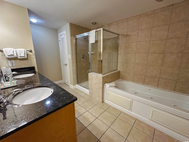 bathroom featuring tile patterned flooring, vanity, and shower with separate bathtub