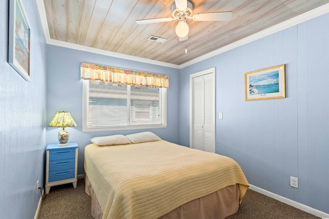 431 28th St S, Sunset Beach, NC 28468 - bedroom with ceiling fan, carpet floors, crown molding, and a closet
