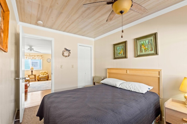 431 28th St S, Sunset Beach, NC 28468 - bedroom featuring ceiling fan, a closet, wood ceiling, and ornamental molding