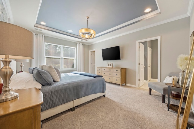 bedroom featuring crown molding, light carpet, and a tray ceiling