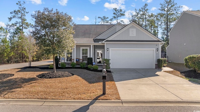 view of front of home with a porch and a garage