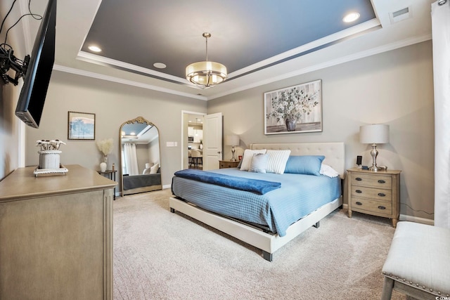 carpeted bedroom featuring a tray ceiling, a chandelier, and ornamental molding