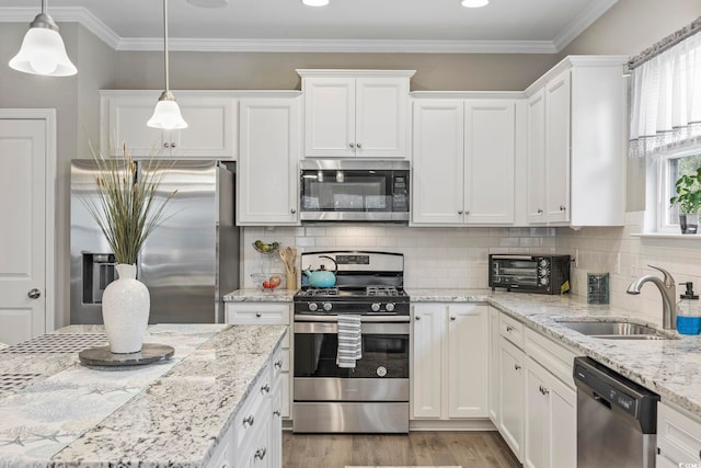 kitchen featuring backsplash, sink, white cabinetry, and stainless steel appliances