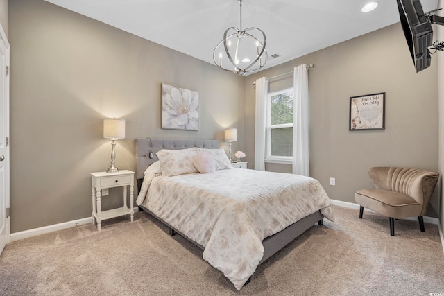 bedroom featuring carpet and a chandelier